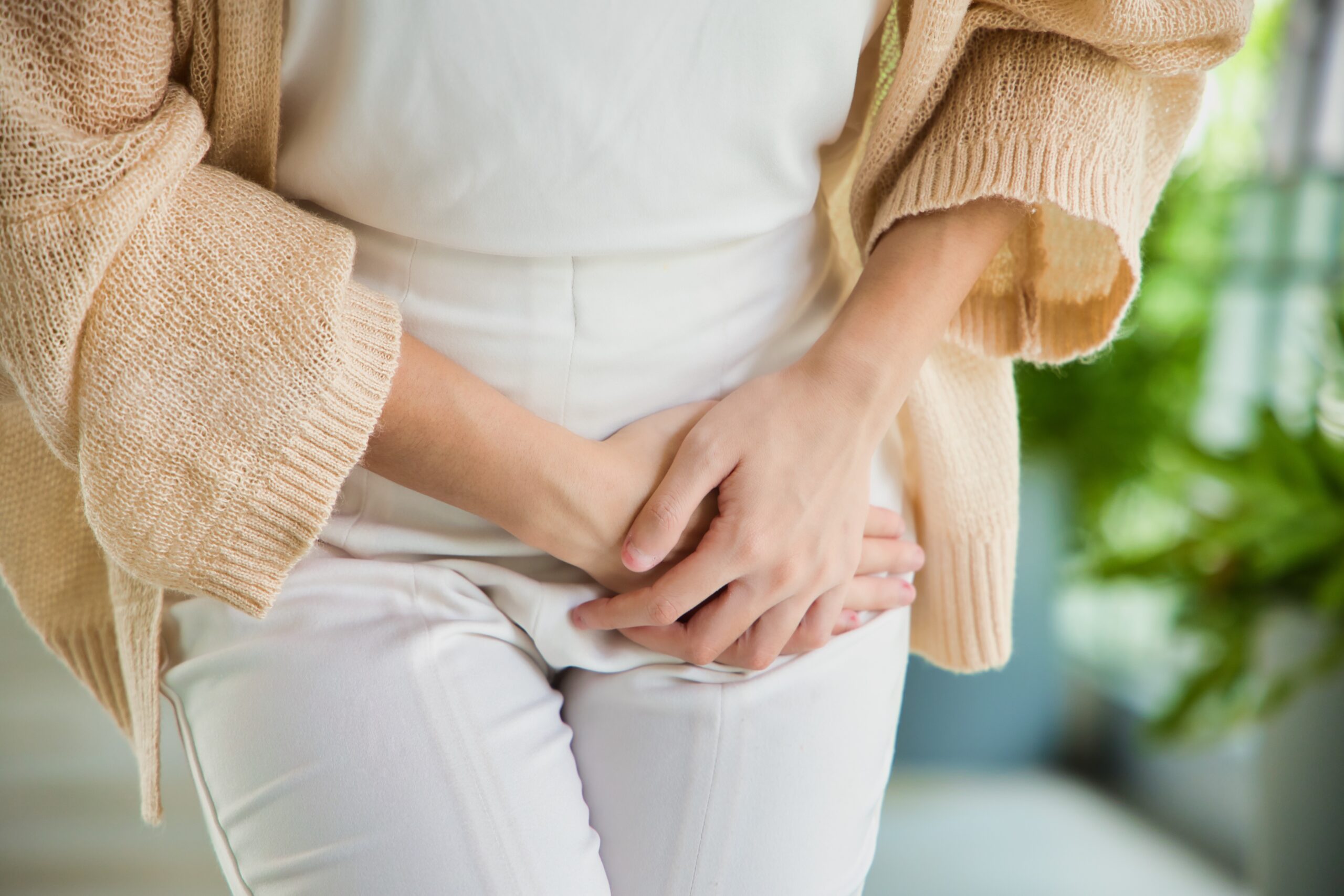 Healthcare Concept Image, Asian woman holding her pee, health care concept of UTI urinary tract infection; urinary incontinence; overactive bladder symptoms, isolated background Urinary incontinence treatment